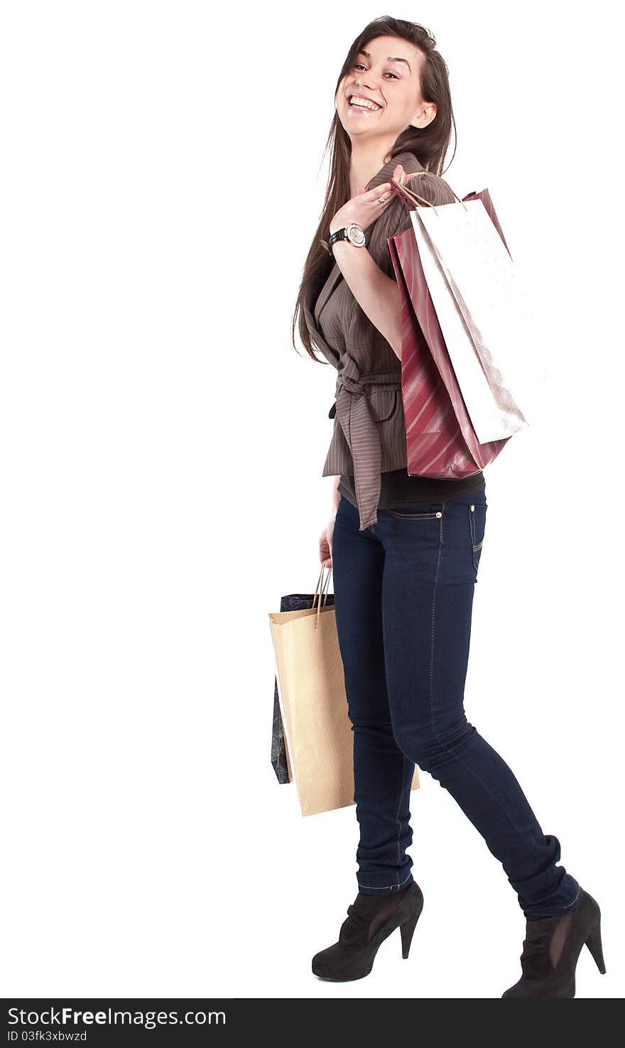 Woman holding shopping bags against a white background