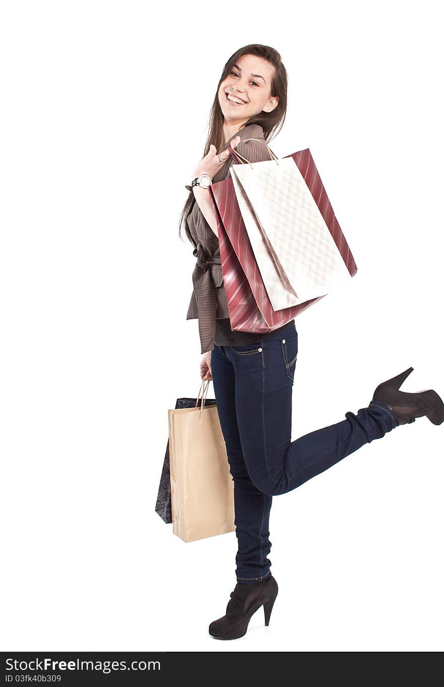 Woman holding shopping bags against a white background