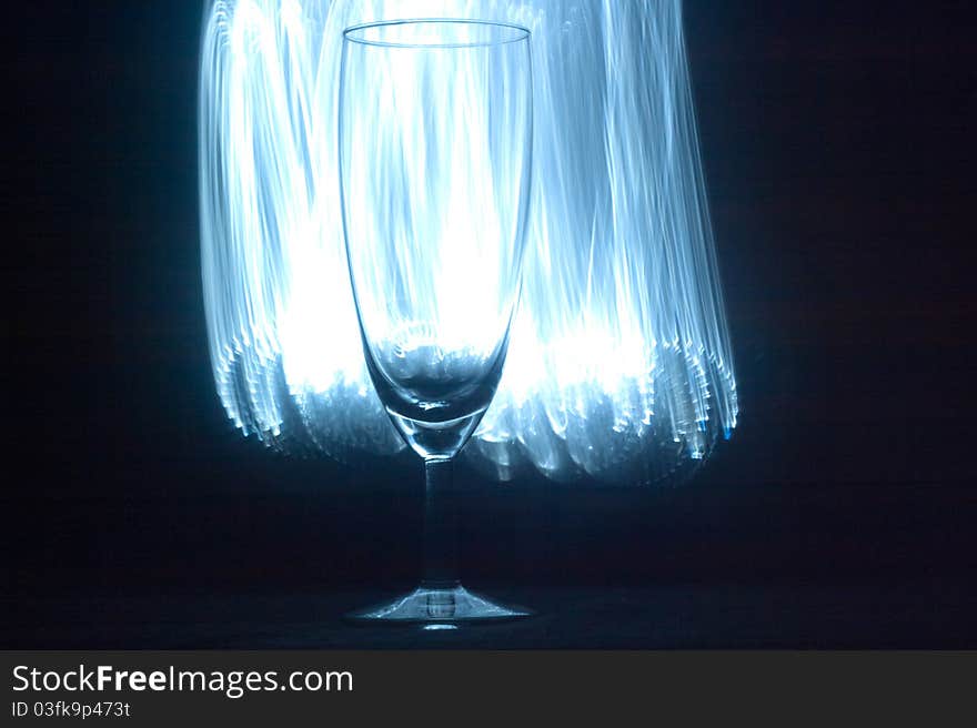 Glass vessels standing on the white table, isolated background