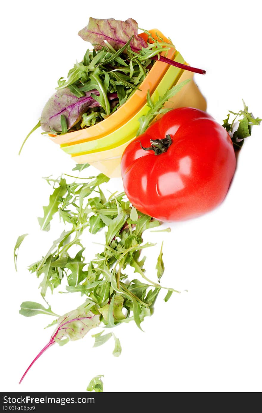 Fresh tomato and a plate of salad (isolated on a white background)