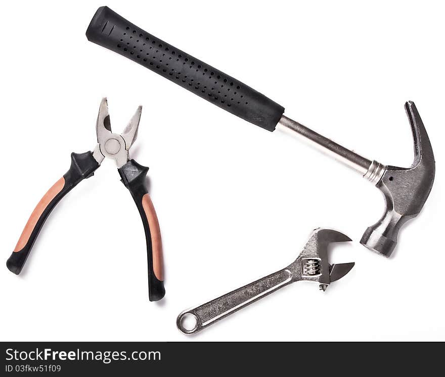 Three construction tools on white background