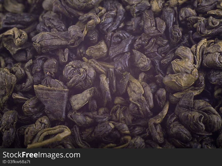 Heap of green tea isolated over white background.