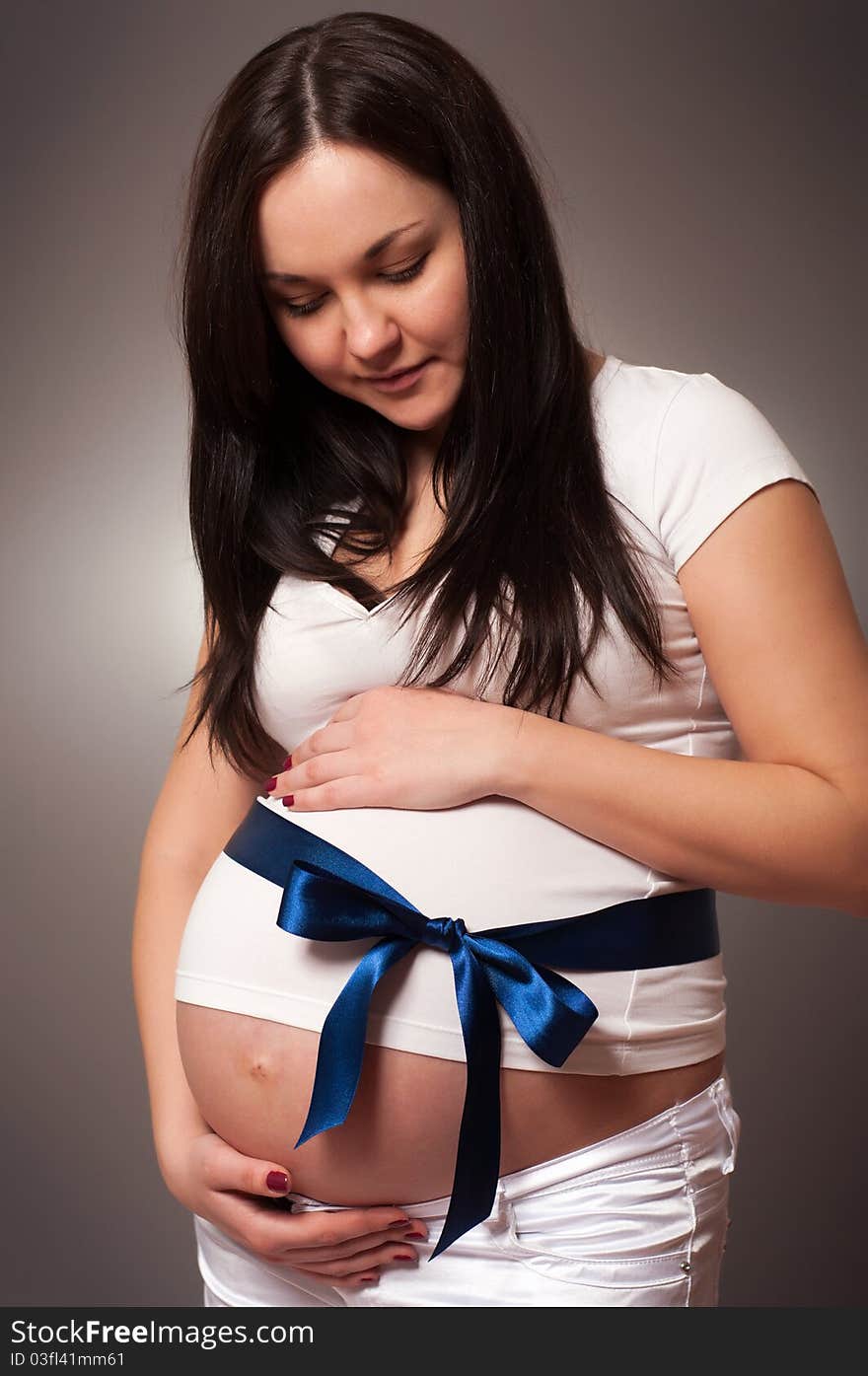 Portrait of joyful beautiful pregnant woman