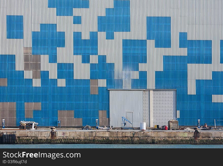 Geometric blue geometric forms on a metal wall. Geometric blue geometric forms on a metal wall