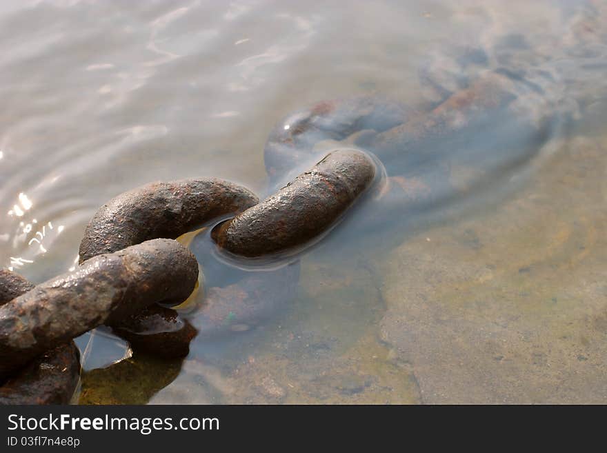 Rusty chain on a water