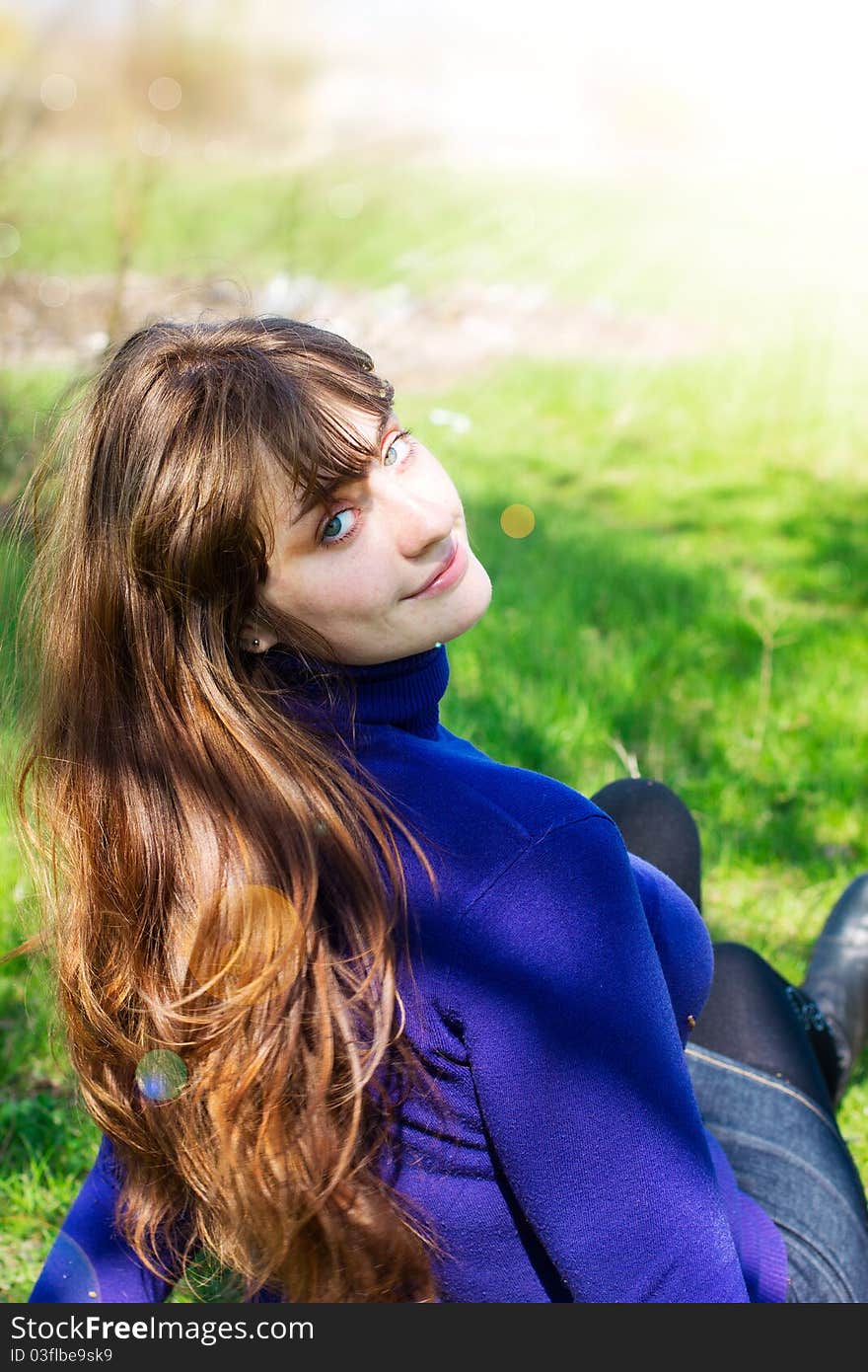 Single beautiful woman relaxing at the park. Single beautiful woman relaxing at the park