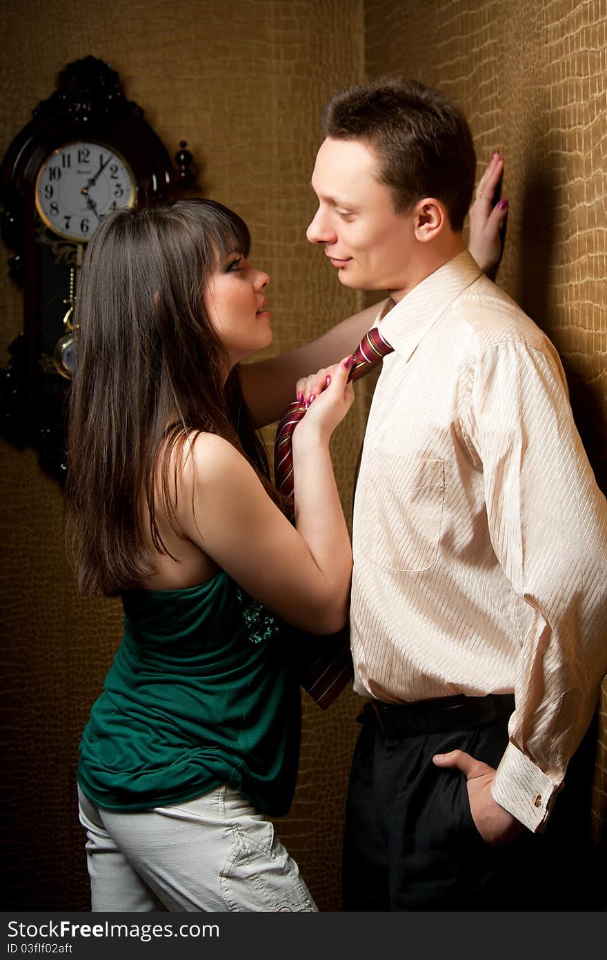 A pair of young married couples in the apartment hallway