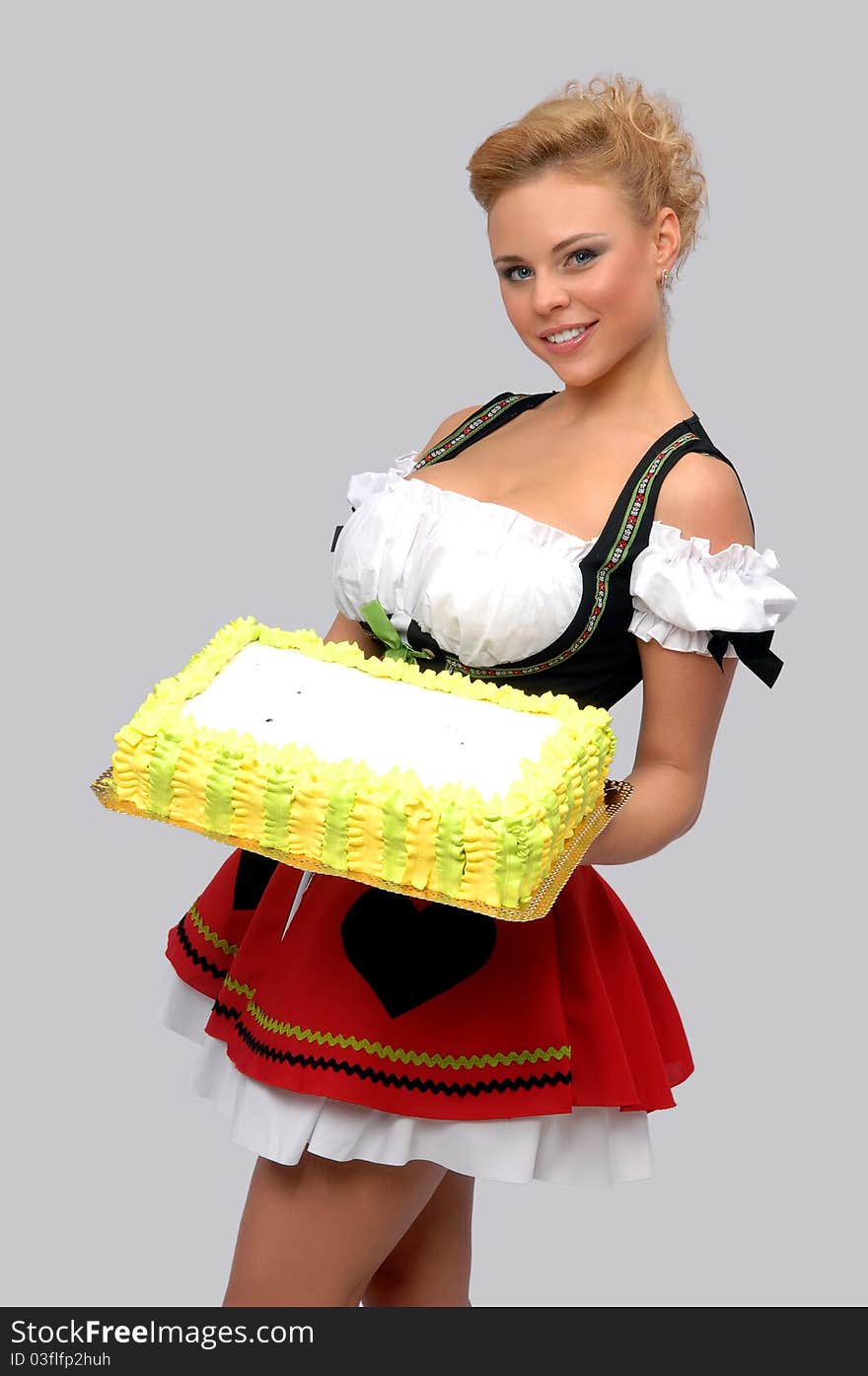 Pretty housewife with a big cake