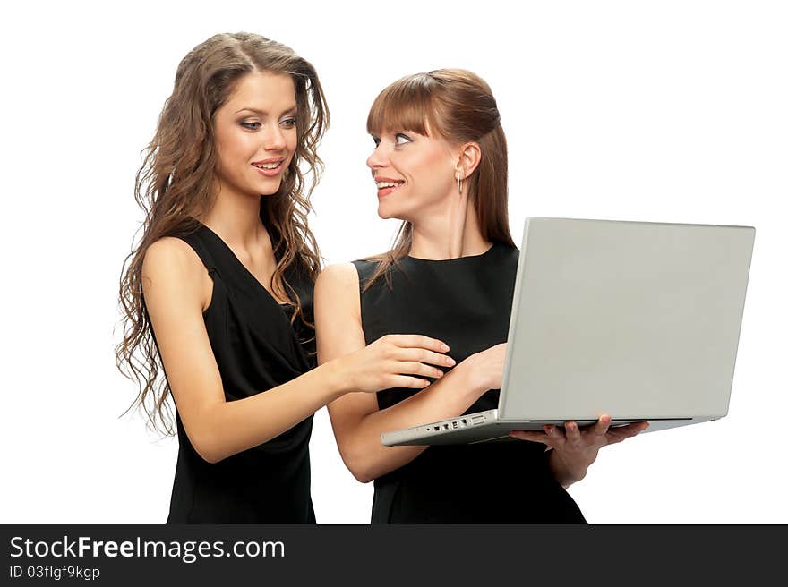 Two women working on a laptop