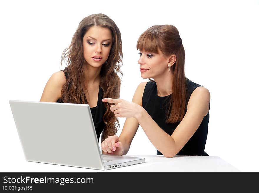 Two Women Working On A Laptop