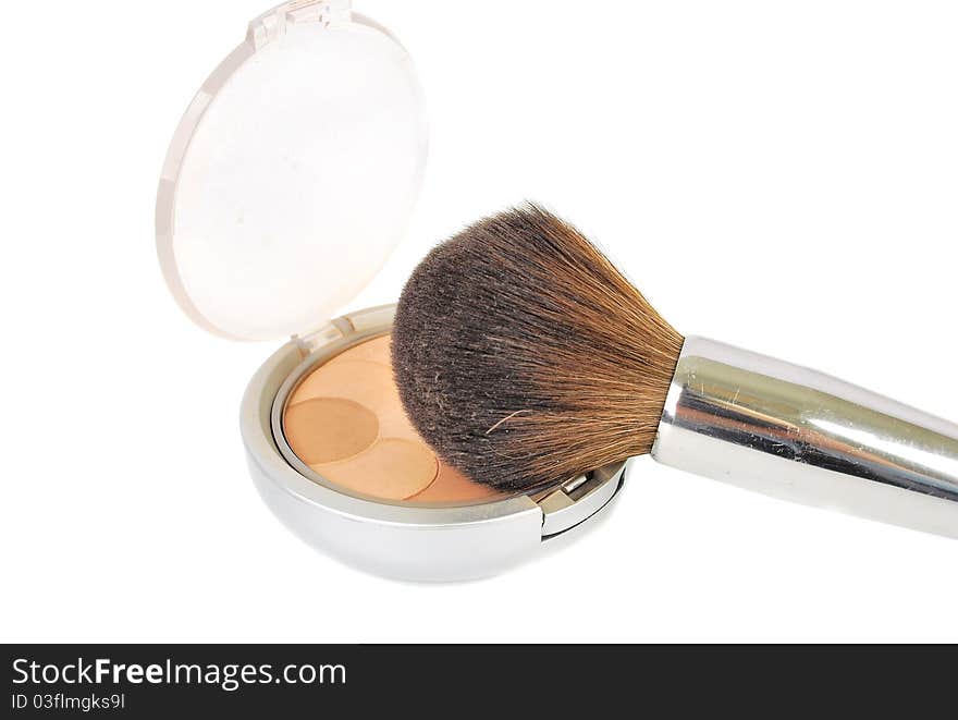 Cosmetic brush and powder makeup isolated on the white background.