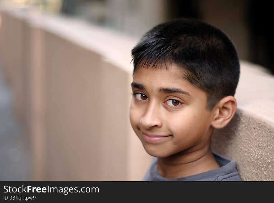 An handsome young indian man posing for the camera. An handsome young indian man posing for the camera