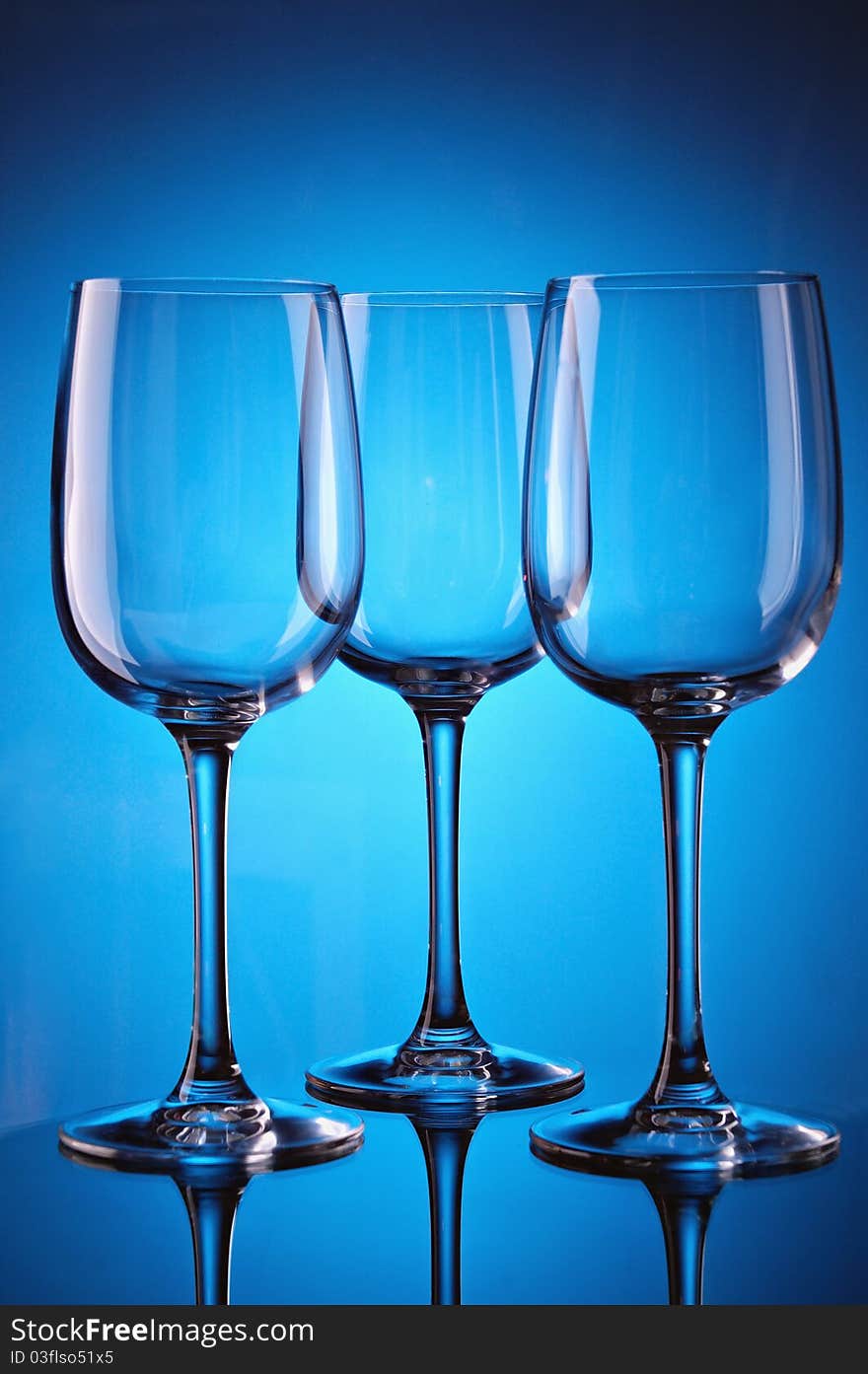 Group of wine glasses on colour a gradient a background