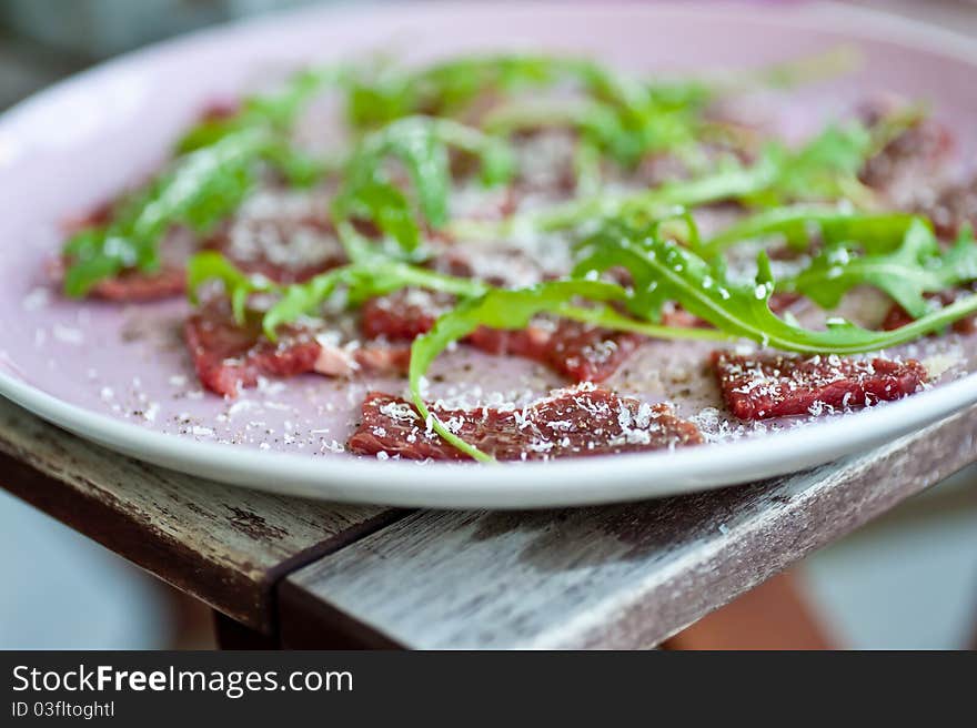 Carpaccio with sallad and parmesan cheese