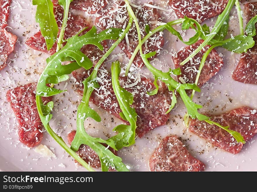 Carpaccio with sallad and parmesan cheese