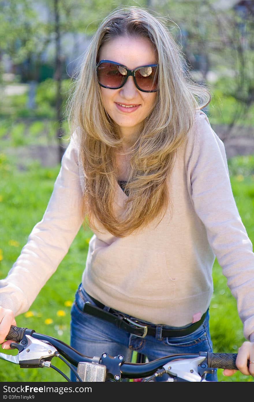 Young woman with bicycle