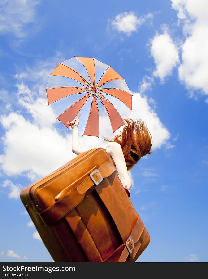 Redhead Enchantress With Suitcase