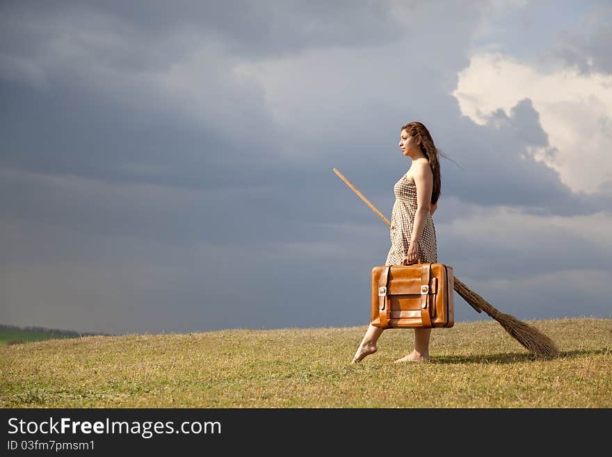 Young Witch At Grass Field