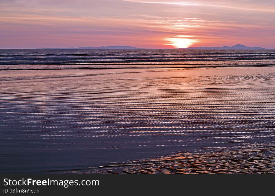 Sunset on deserted Barmouth beach. Sunset on deserted Barmouth beach