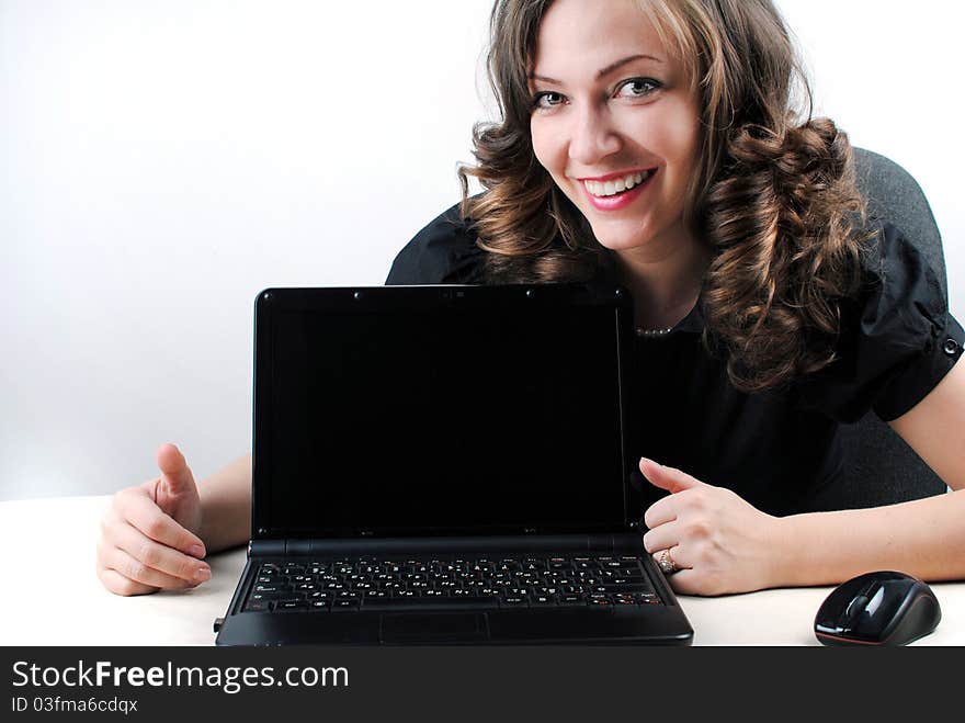 Business woman showing blank laptop