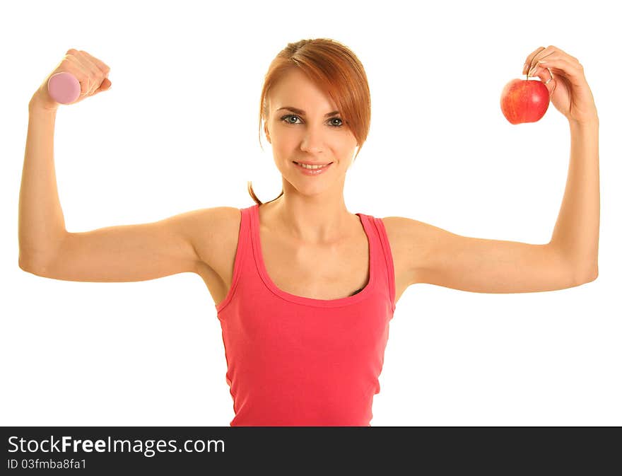 Woman with apple and dumbbell