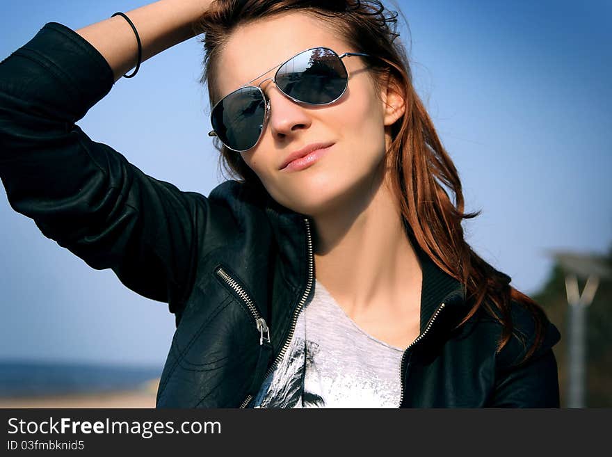 Attractive woman relaxing on beach