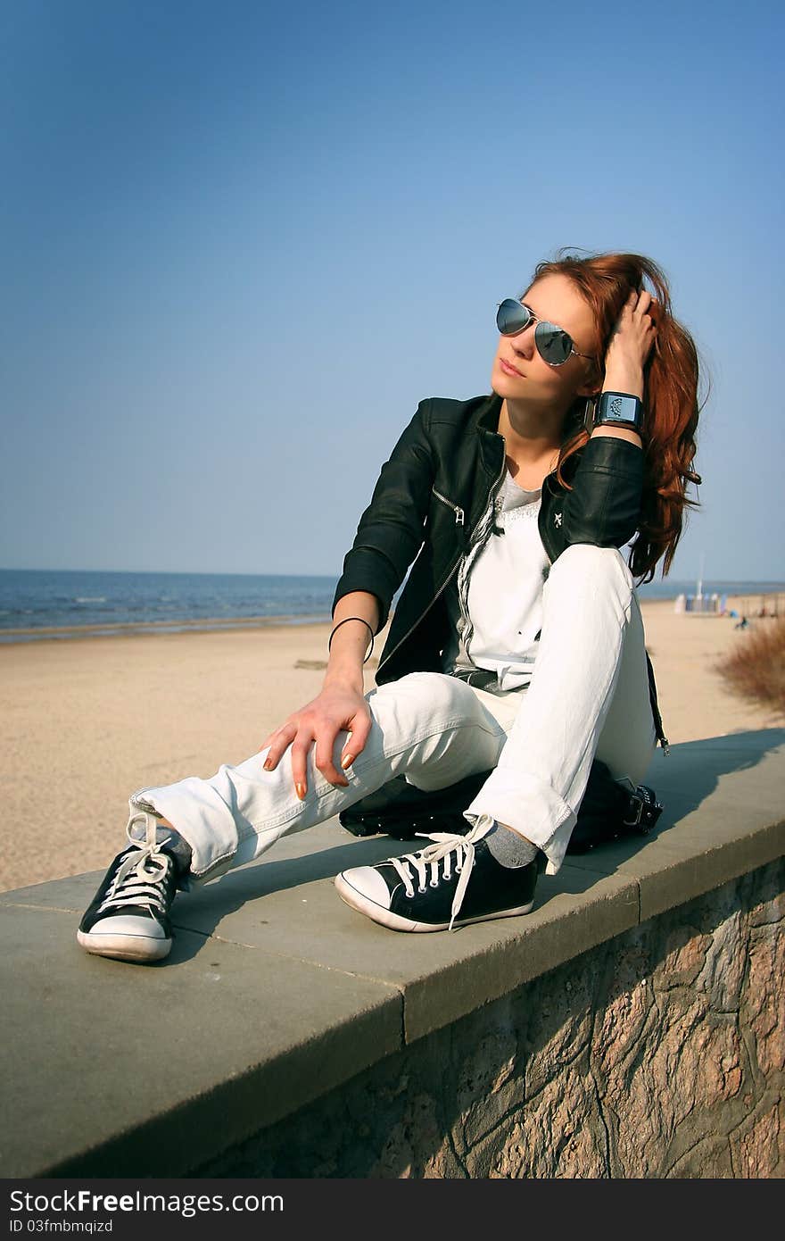 Attractive woman relaxing on beach