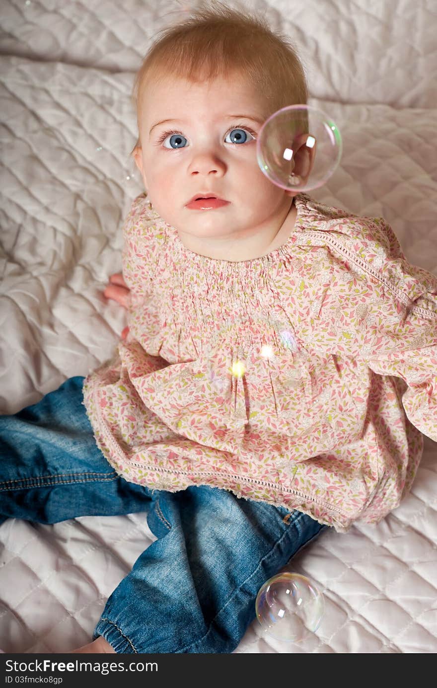 Closeup portrait of little cute baby girl with bubbles. Closeup portrait of little cute baby girl with bubbles