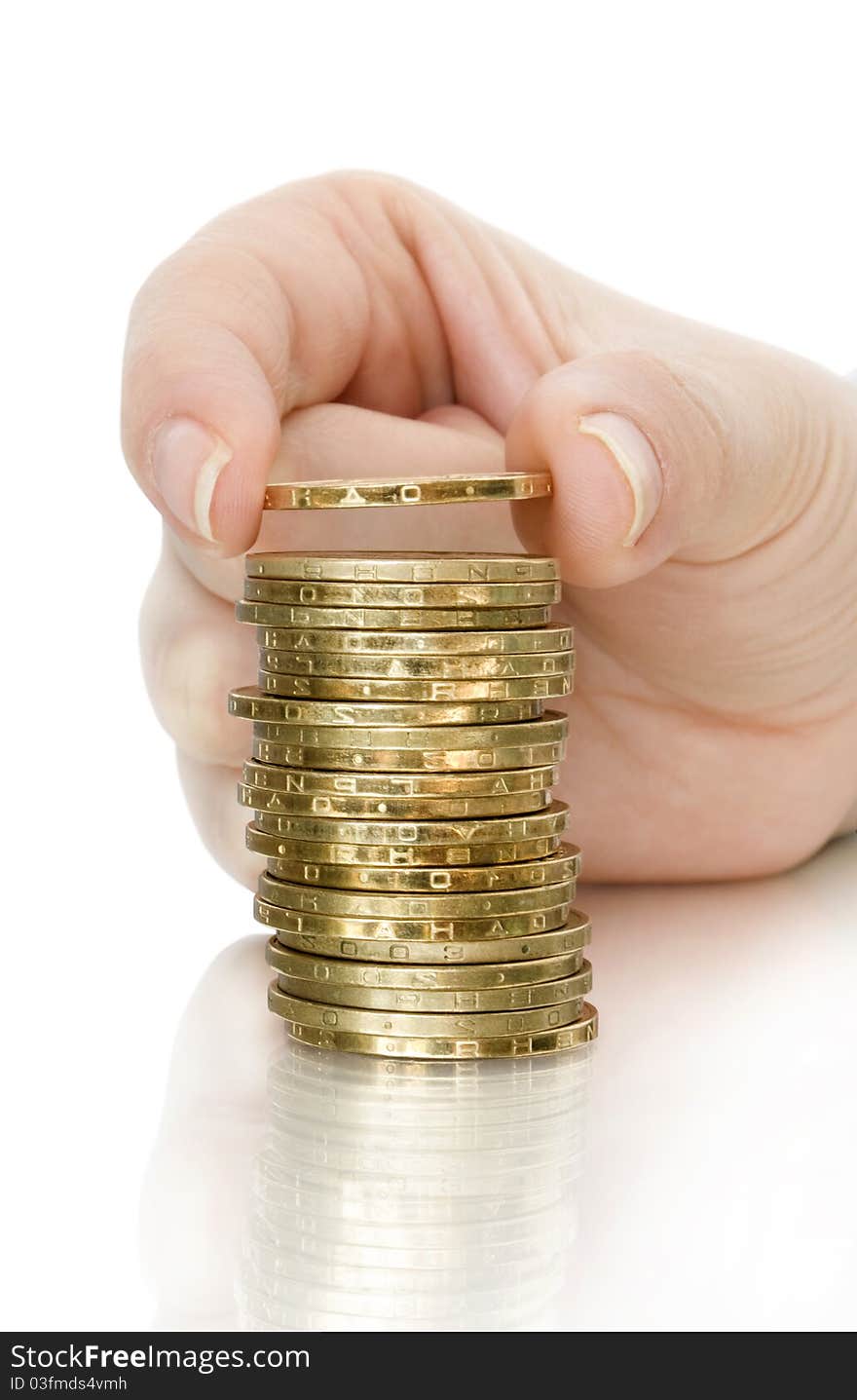 Stack of coin and coin in finger with reflection