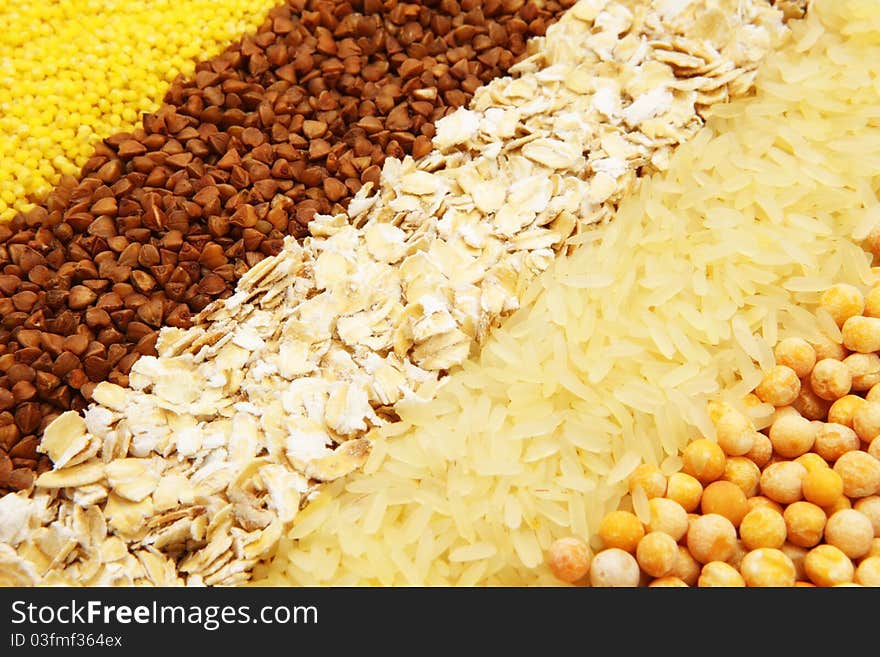 Various kinds of groats are spread out by numbers: a buckwheat, rice, peas, oat-flakes, groats. Various kinds of groats are spread out by numbers: a buckwheat, rice, peas, oat-flakes, groats