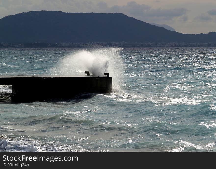 Wave Breaking Against Stone Mooring