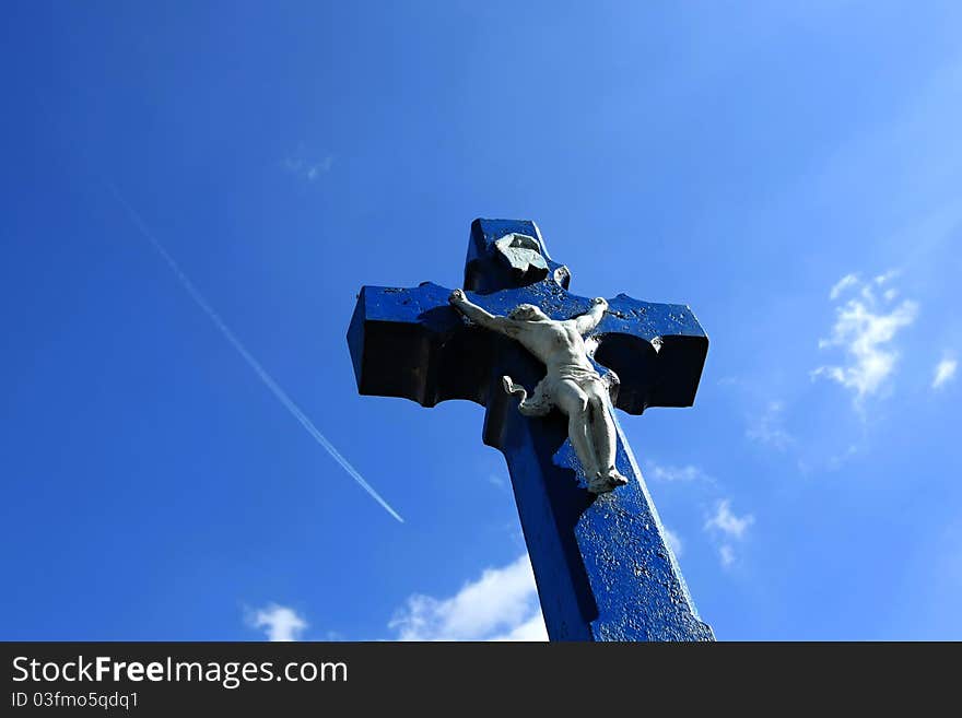 Blue Cross of Jesus Christ near the road in Vemyslice on south Moravia