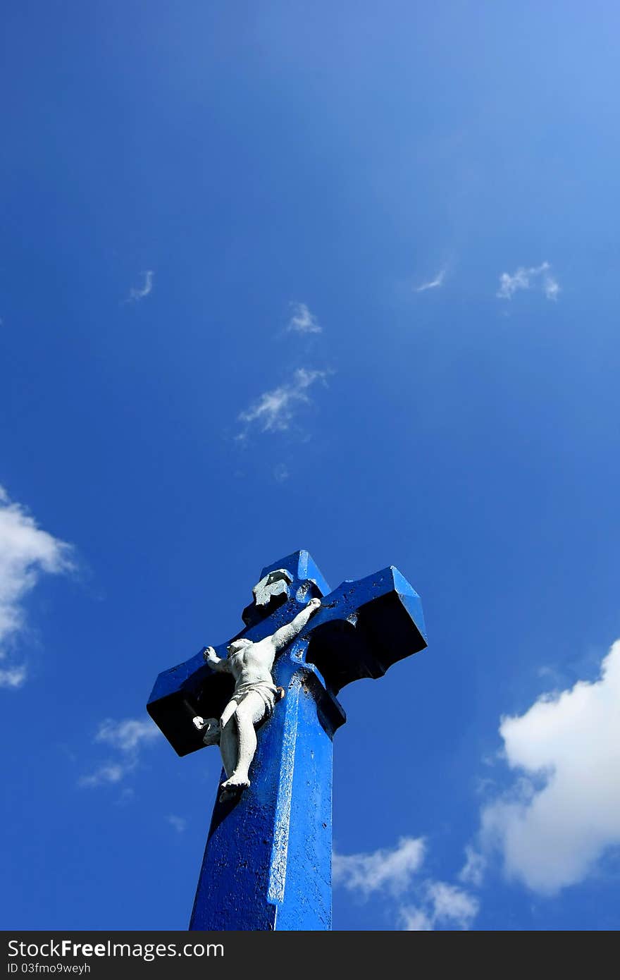 Blue Cross of Jesus Christ near the road in Vemyslice on south Moravia