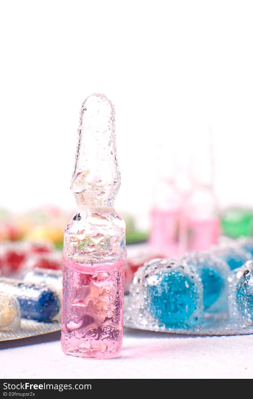 Blister packs of pills with water droplets