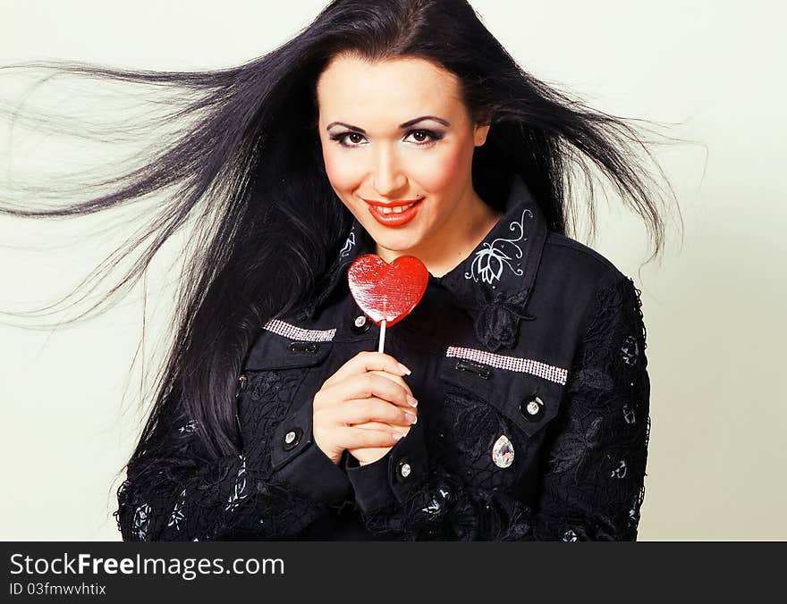 Lovely brunette with a lollipop. Lovely brunette with a lollipop