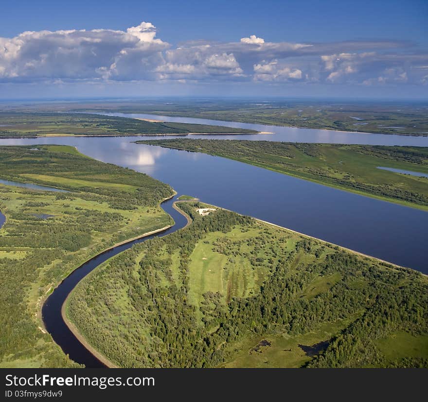 Aerial view of a large lowland river.