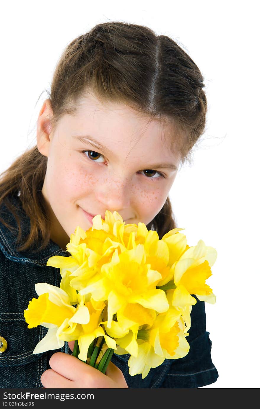 Cute little girl giving flowers. Studio shot