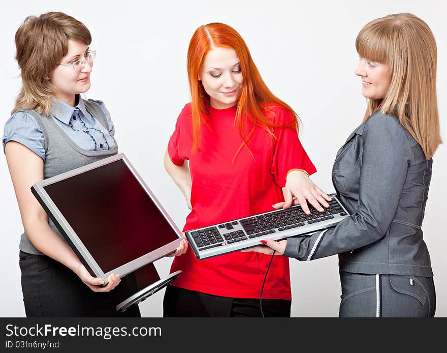 Women with a monitor and keyboard on grey background