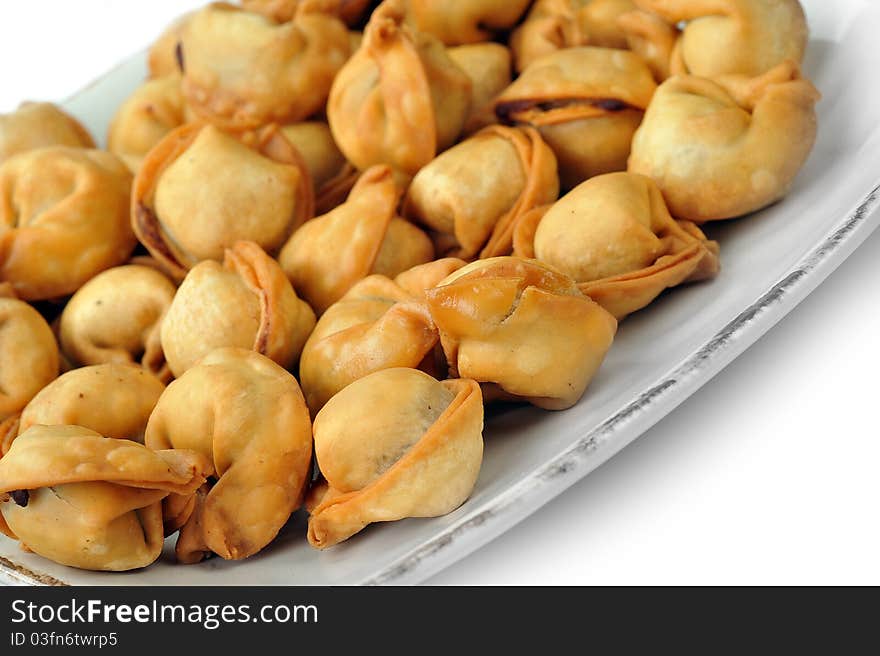 Chinese dumblings fried  in oil served on plate