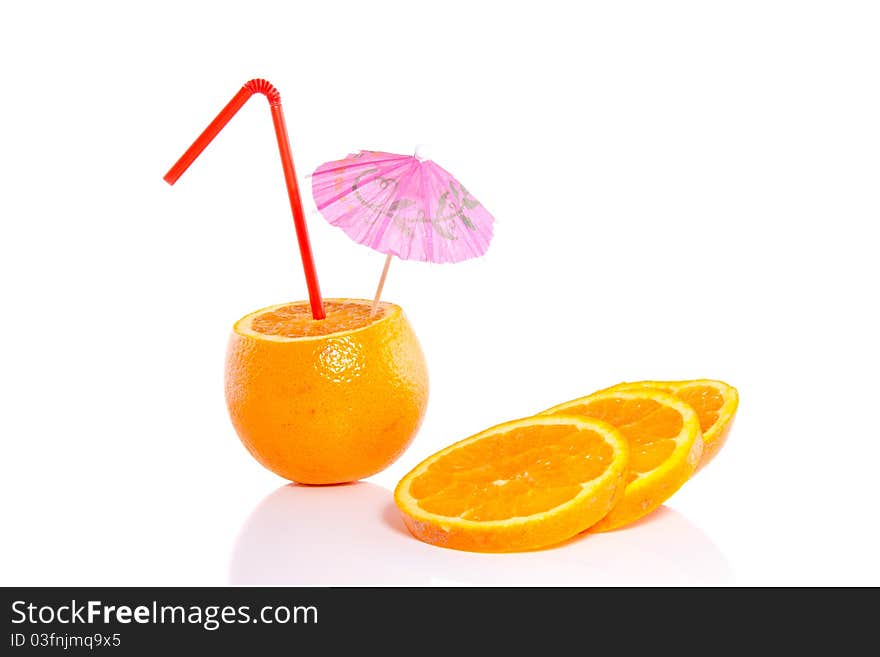 An orange with a straw and parasol isolated over white background