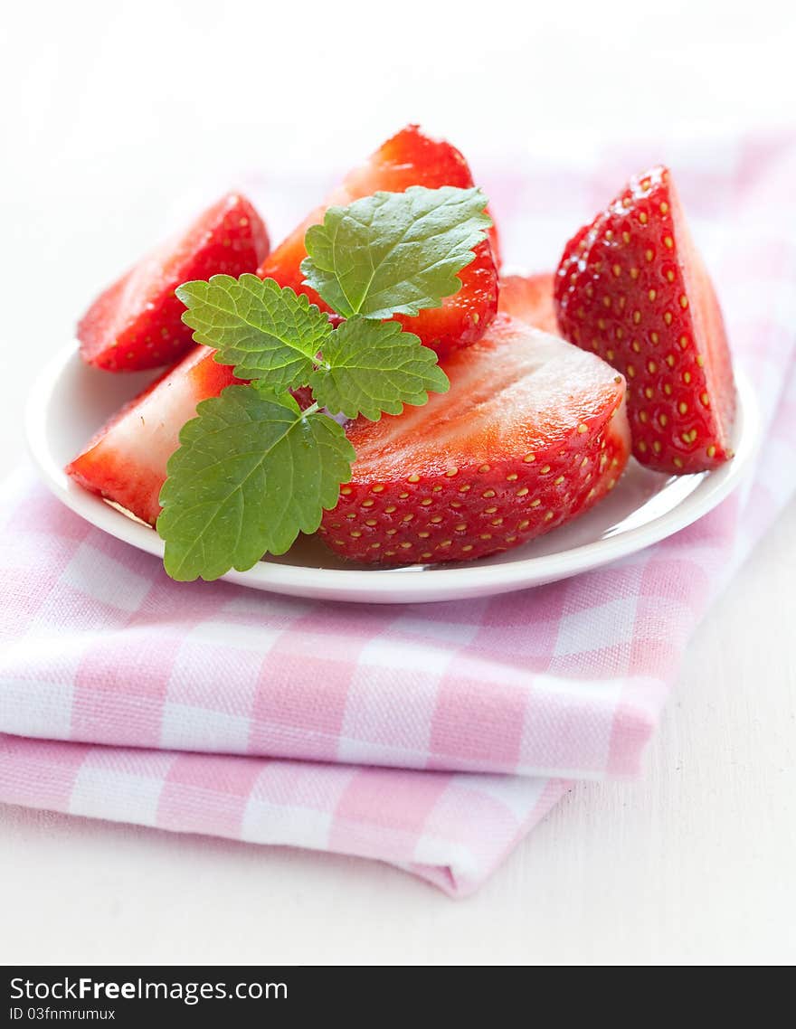 Fresh sliced strawberries with mint. Fresh sliced strawberries with mint