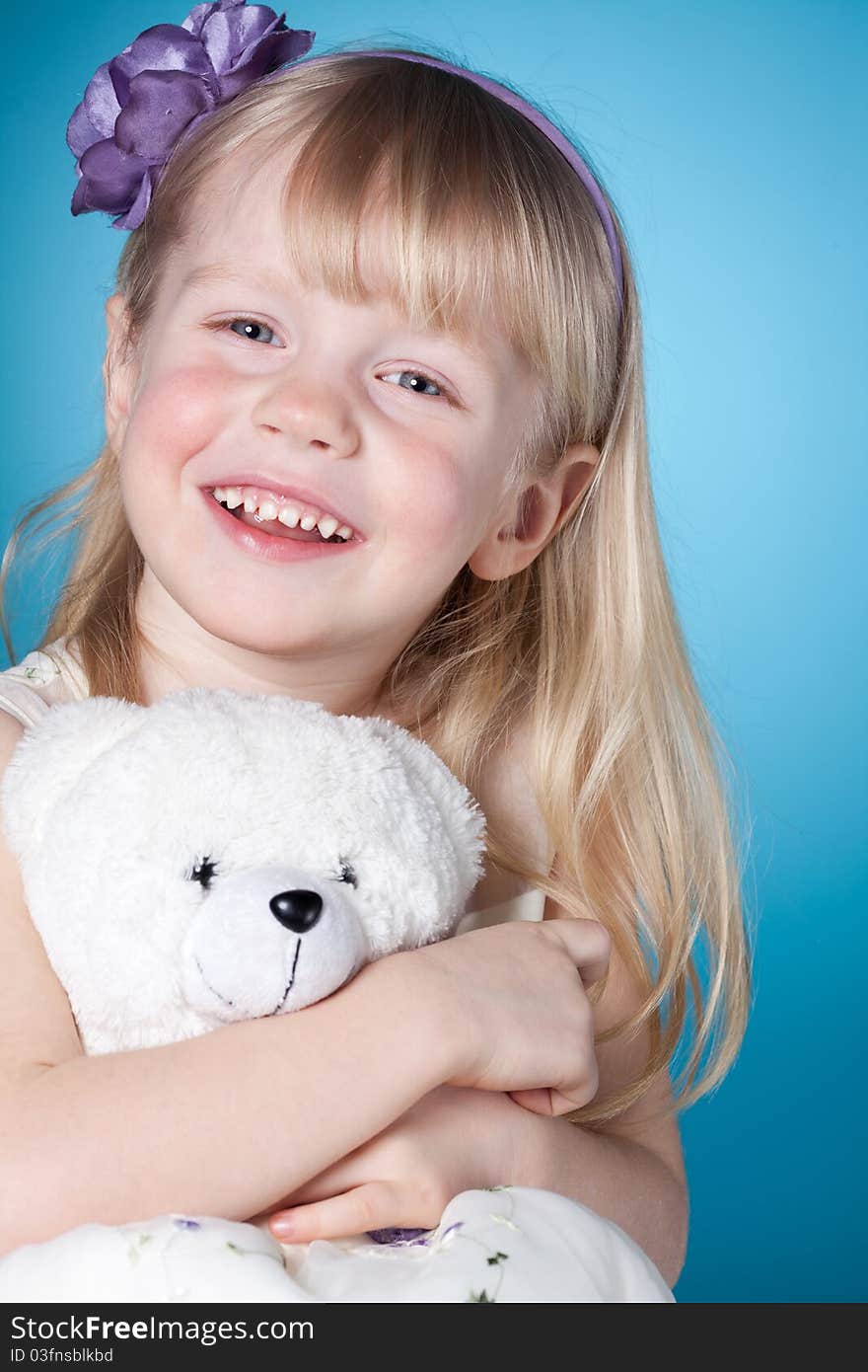 Happy Smiling Little Girl With Toy