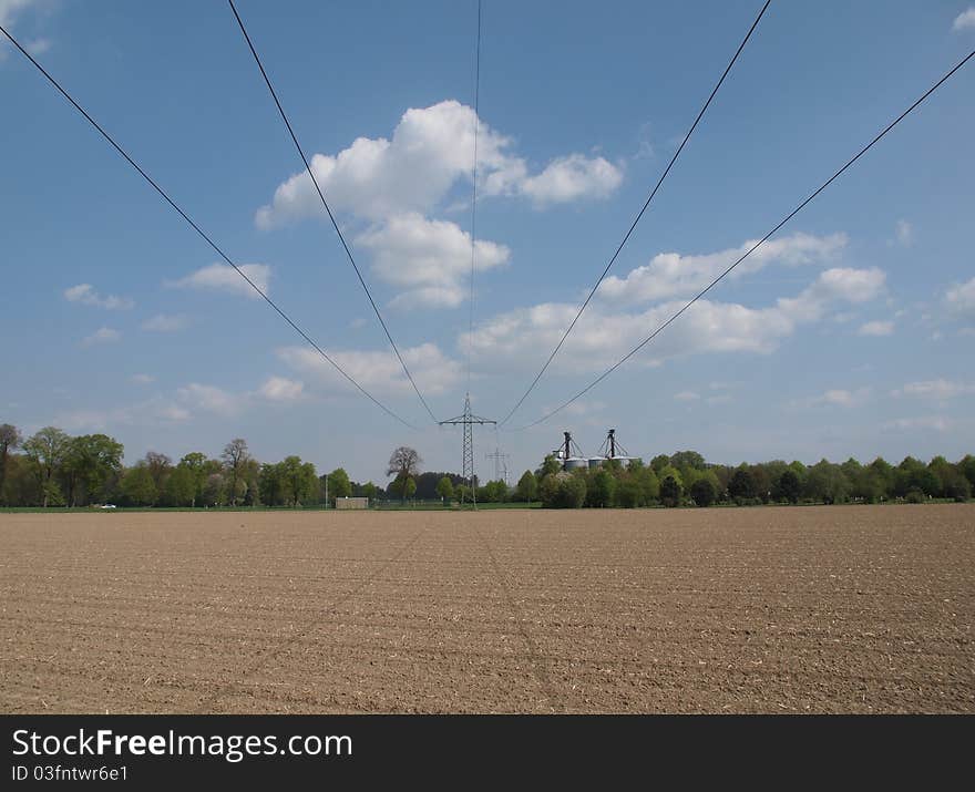 High voltage power line against blue sky