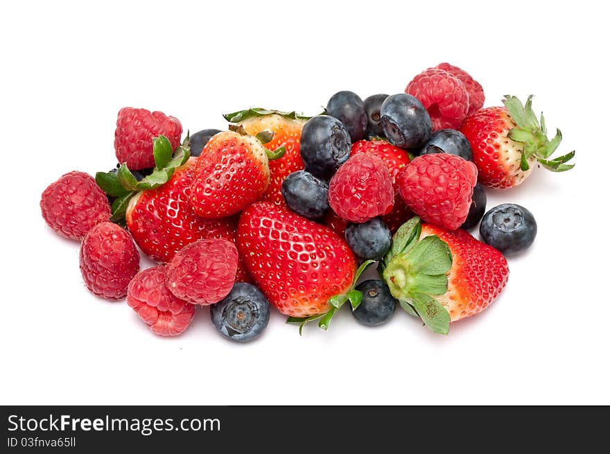 Raspberries,strawberries and blueberries over white background