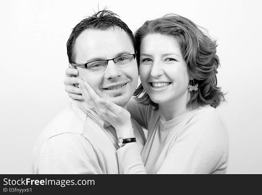 Young Beautiful Happy Couple Smiling in the Engagement Day in a tender moment