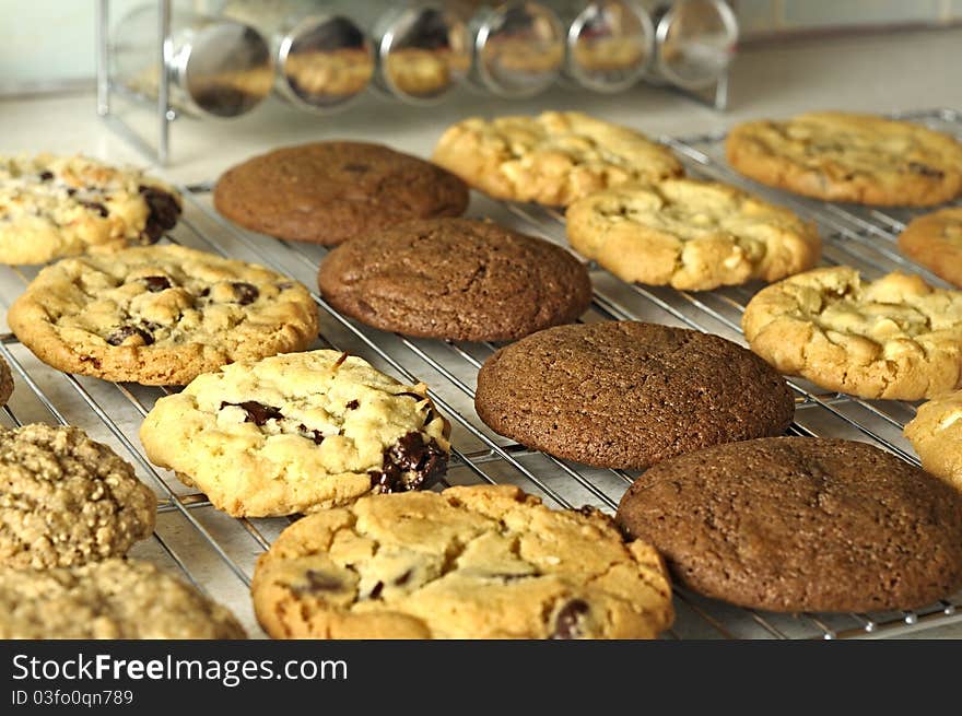 A baking rack of freshly baked home made cookies. A baking rack of freshly baked home made cookies