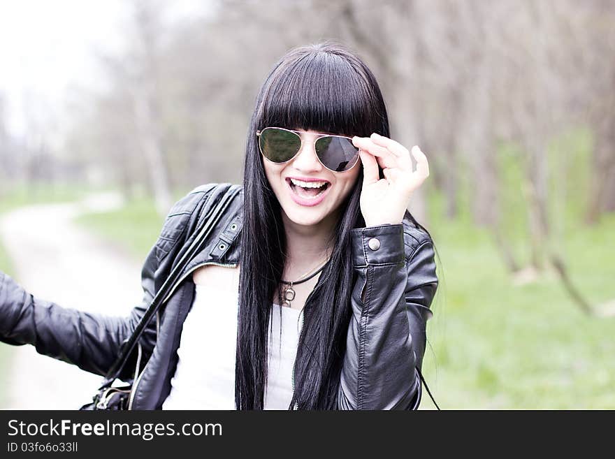 Beautiful young woman wearing sunglasses