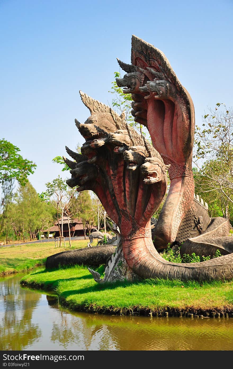 The king of Naga Statue is a stone sclupture of 5 heads snake -- thailand