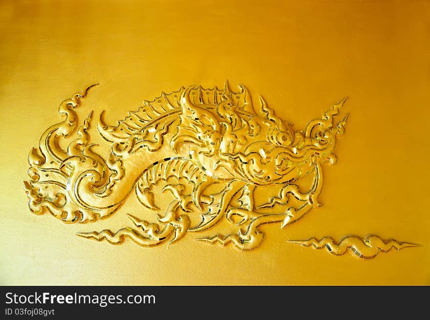 The wall sculpture of the golden fish