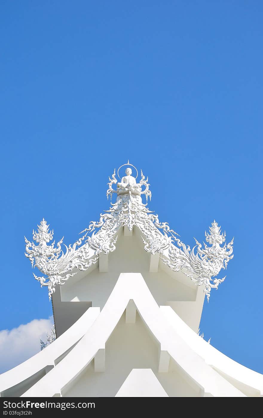 The white buddha on the roof of temple